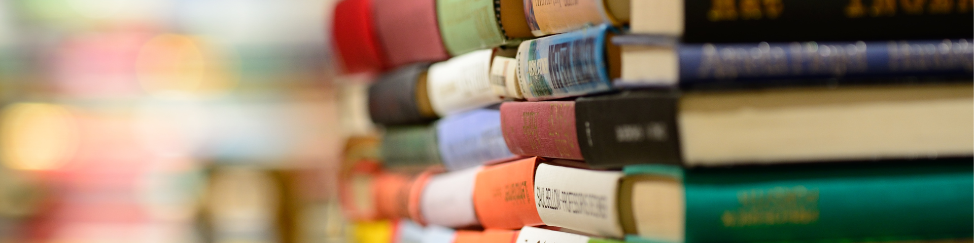 Colorful books stacked in a library
